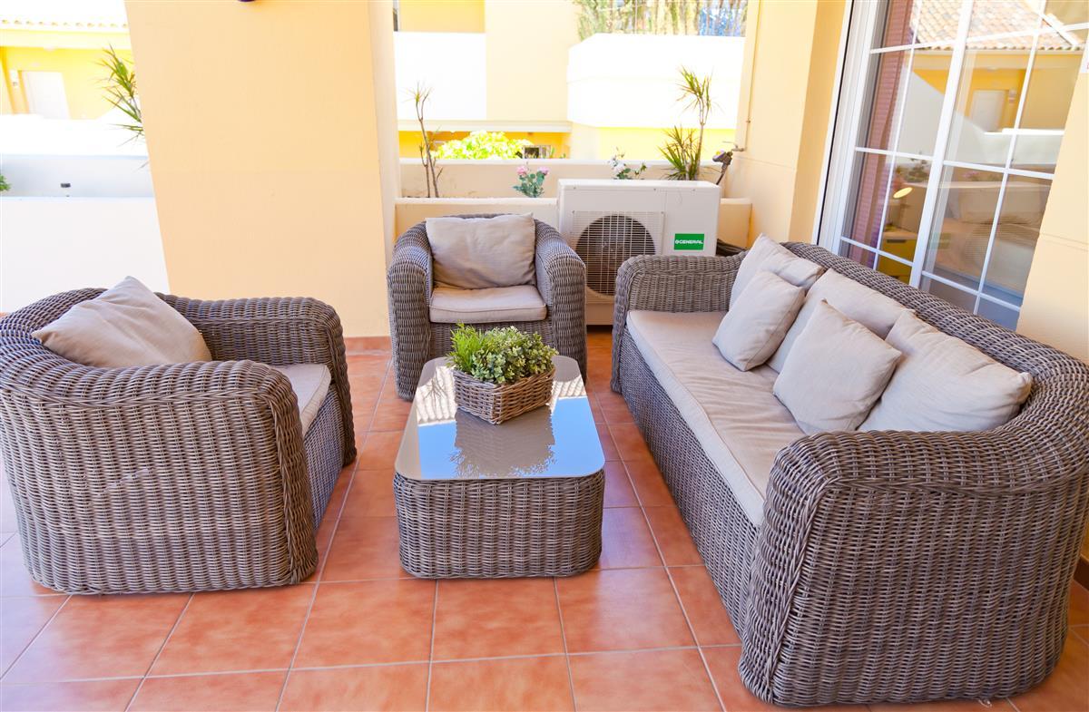 Comfortable_seating_area_on_the_terrace_with_dining_beyond